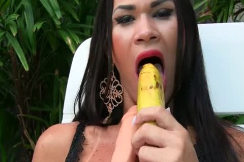 ladyboy Masturbates With A Banana And A thick fake penis